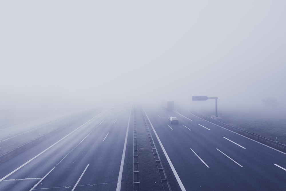 road passing by in road while fogging