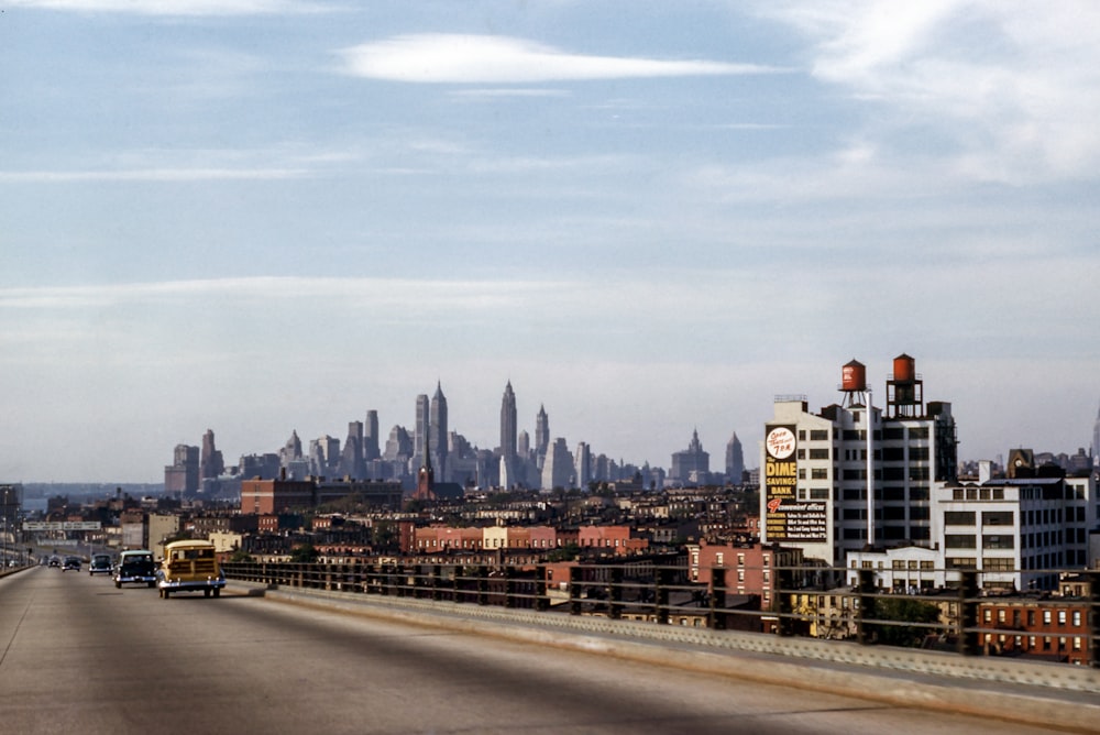 landscape photo of buildings near fly over during daytime