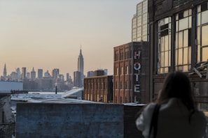 woman taking photo of buildings