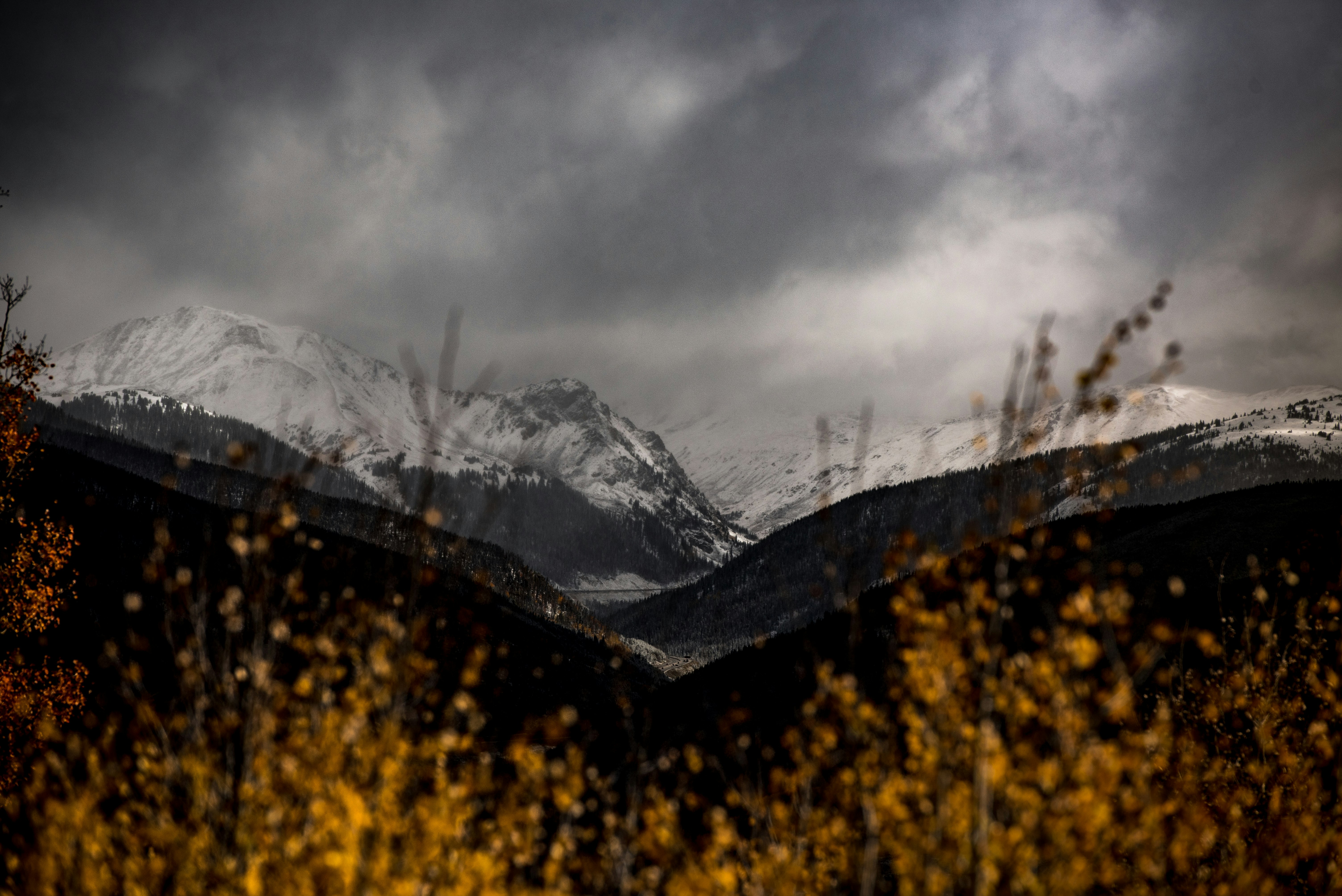 snow mountain covered by dark clouds