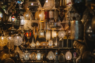 A variety of decorative lanterns displayed outdoors.