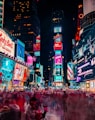 time-lapse photography of crowd of people on New York Time square during night time