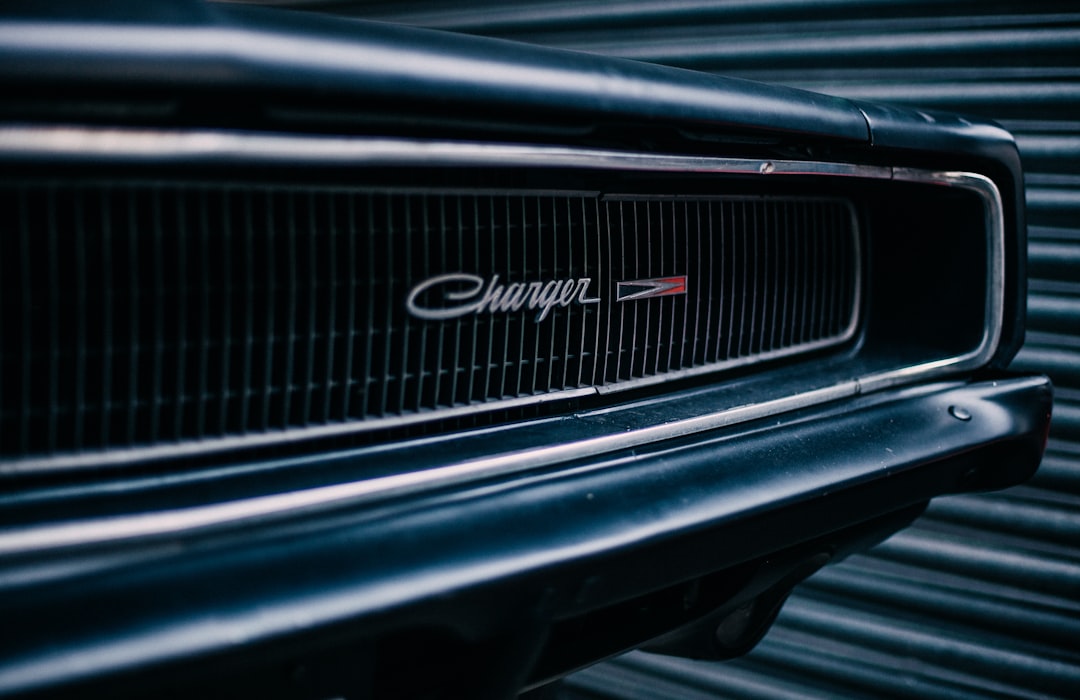 I had the awesome pleasure today of being invited for a private photoshoot, where the location was an actual lock-up garage full of vintage cars. I was like a child in a sweet shop, snapping away at every opportunity. This Charger poised elegantly against that metal shutter was just calling out to me. Sorry folks I couldn’t resist! haha!