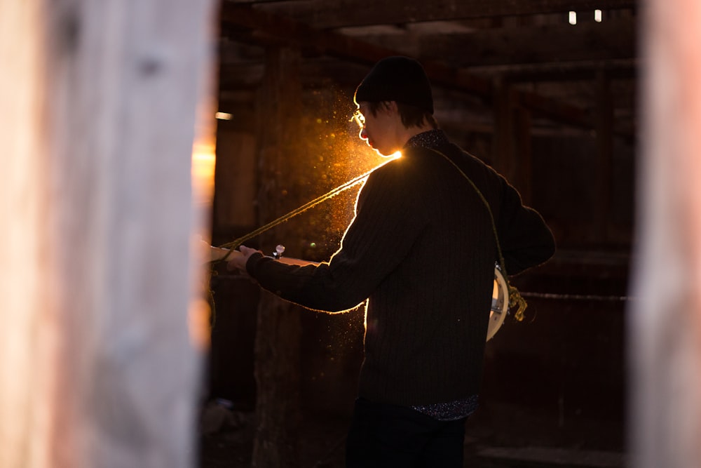 person using guitar