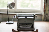 Elegant workspace with a vintage typewriter and soft natural light.