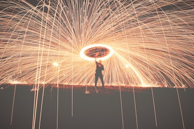 man holding fireworks explosive zoom background