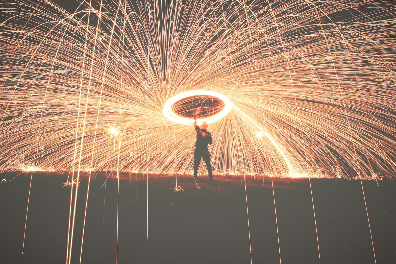 Canon EOS 60D + Canon EF 24-105mm F4L IS USM sample photo. Man holding fireworks photography