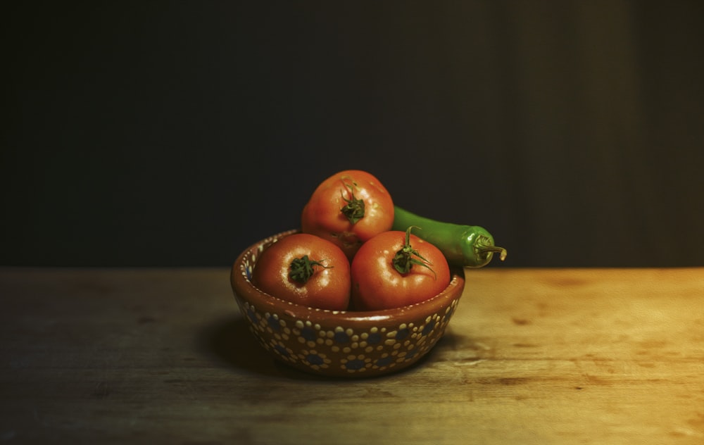 orange fruit on brown woven basket