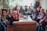 A diverse group of women engaged in a supportive discussion during a workshop.