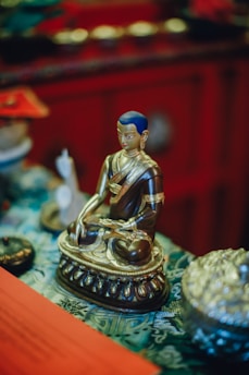 Golden Sri Yantra glowing softly against a dark red background with subtle saffron accents