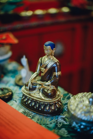 Golden Sri Yantra glowing softly against a dark red background with subtle saffron accents
