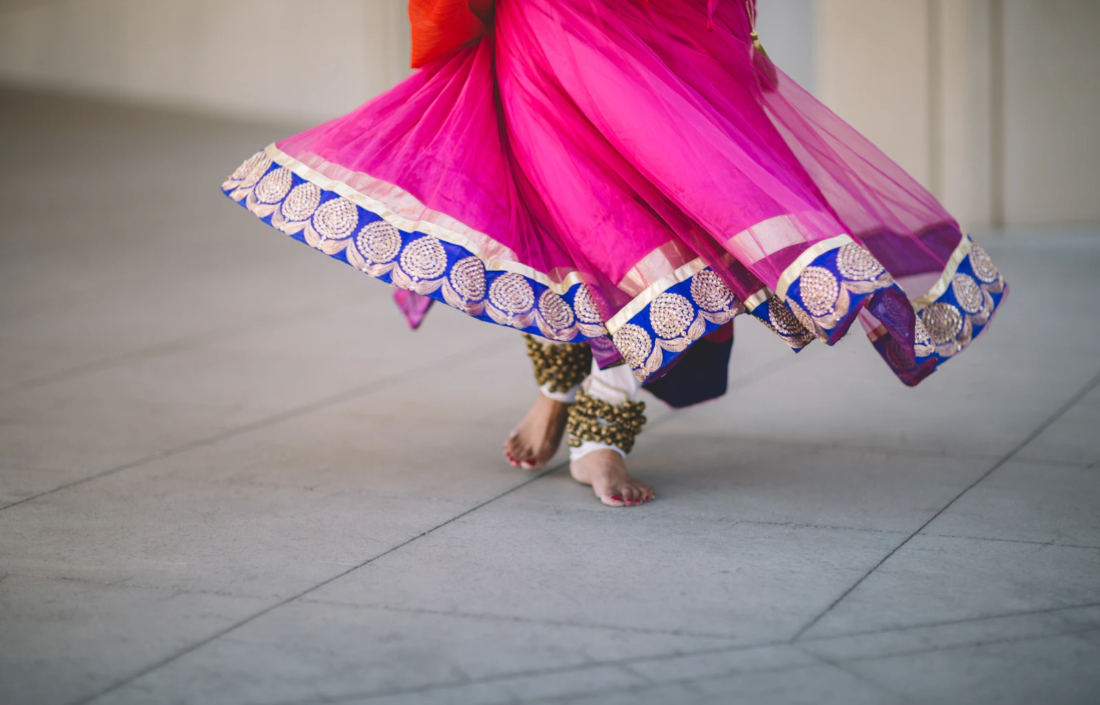 Indian classical Kathak dancer mid-performance in traditional dress