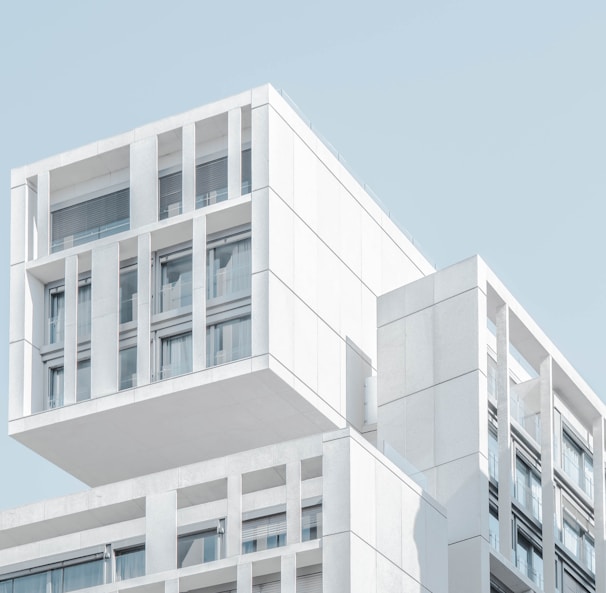 white modern cement building under blue sky