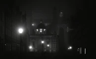 A moody black-and-white shot of a nighttime cityscape with Ghostville’s logo subtly glowing.