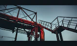 Structural steel framework rising against a sunset backdrop in the Eastern Province.