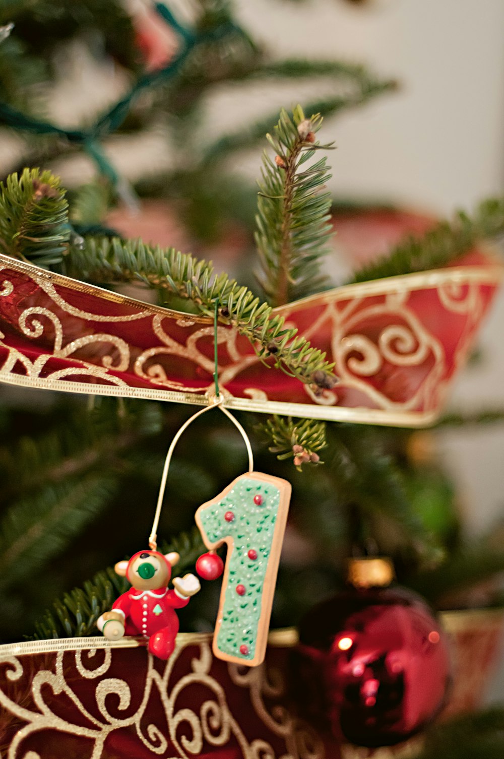 blue number 1 ornament hung on Christmas tree