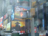 Workers installing a large billboard in a busy Istanbul street.
