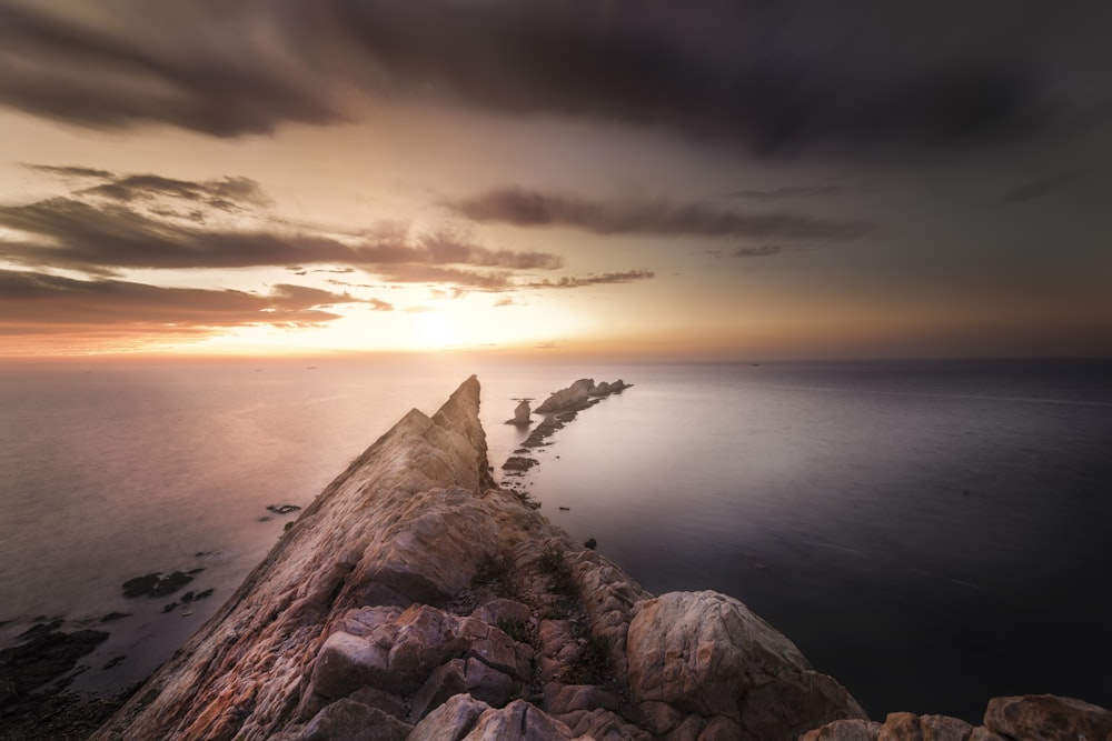 brown rock formation during sunset