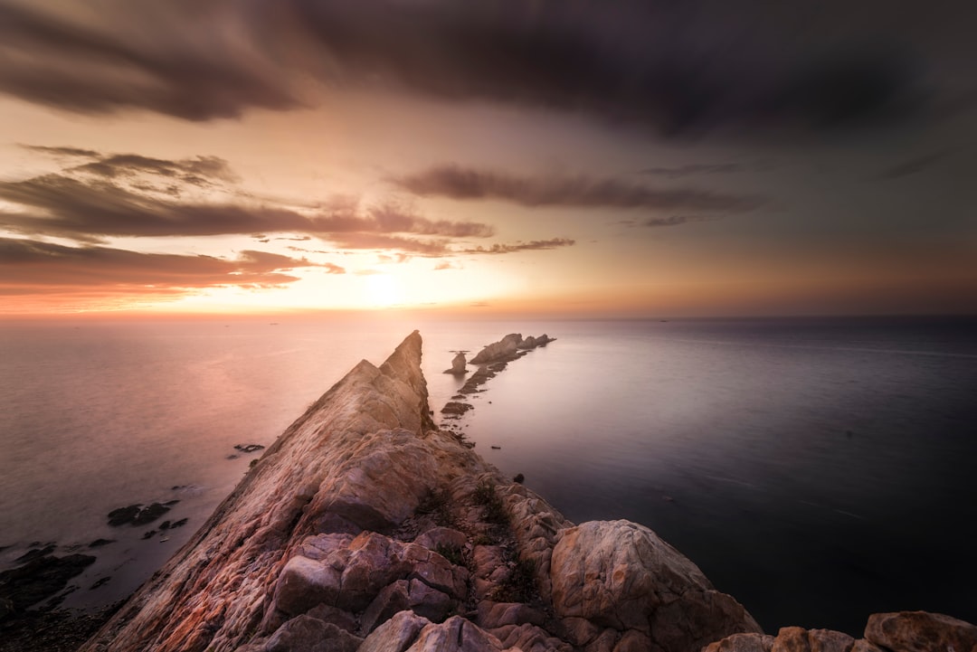 brown rock formation during sunset