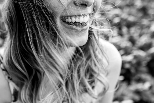Close-up of a patient smiling confidently after a dental treatment at Sonrisa Viva.