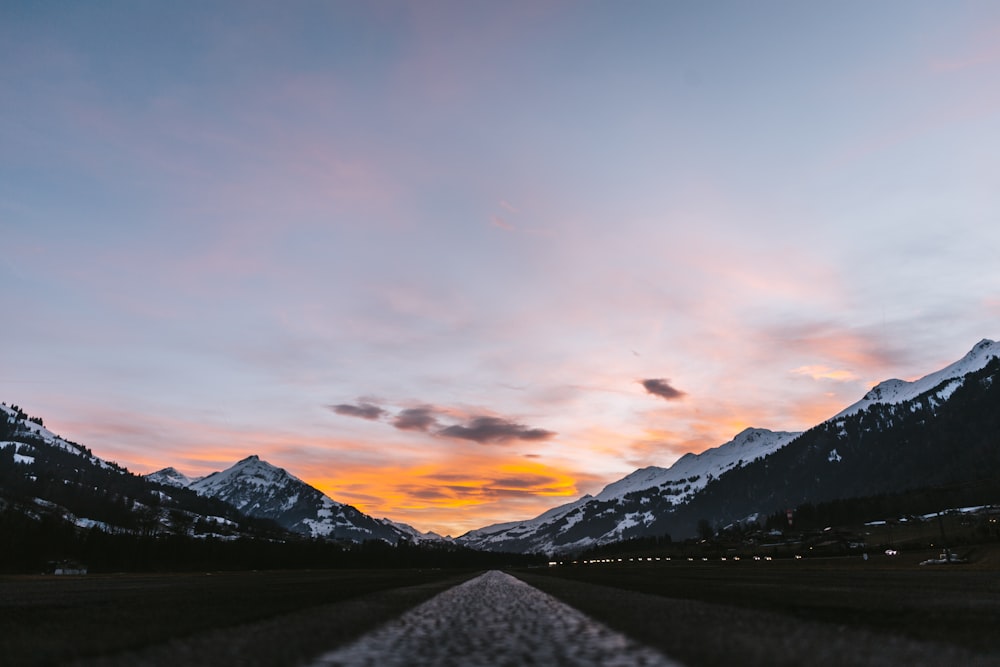 asphalt road near mountains