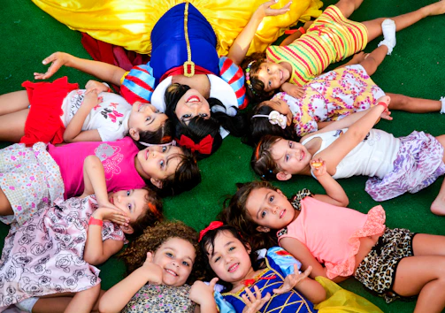 A group of fairytale characters gathered for a lively meet and greet with children.