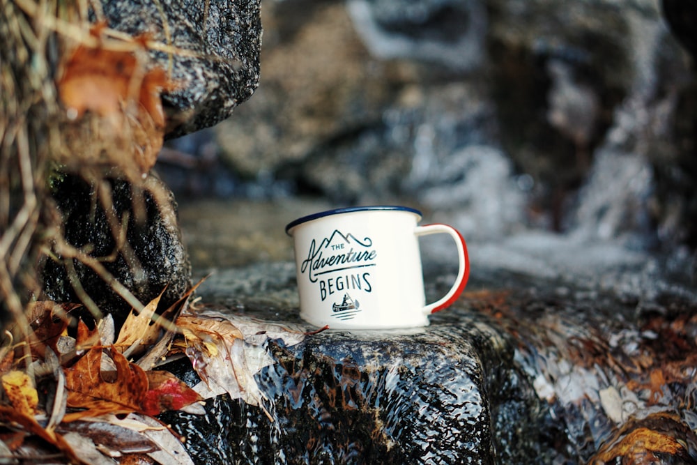 macro shot of white ceramic mug on waterfalls