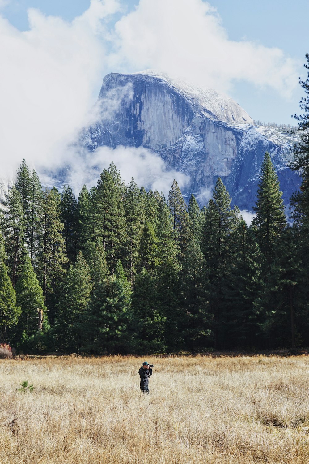 man taking photo on firld