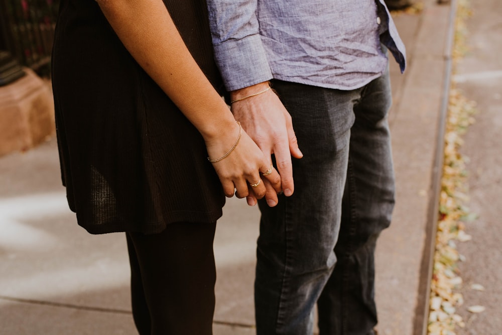 woman touching man's hand