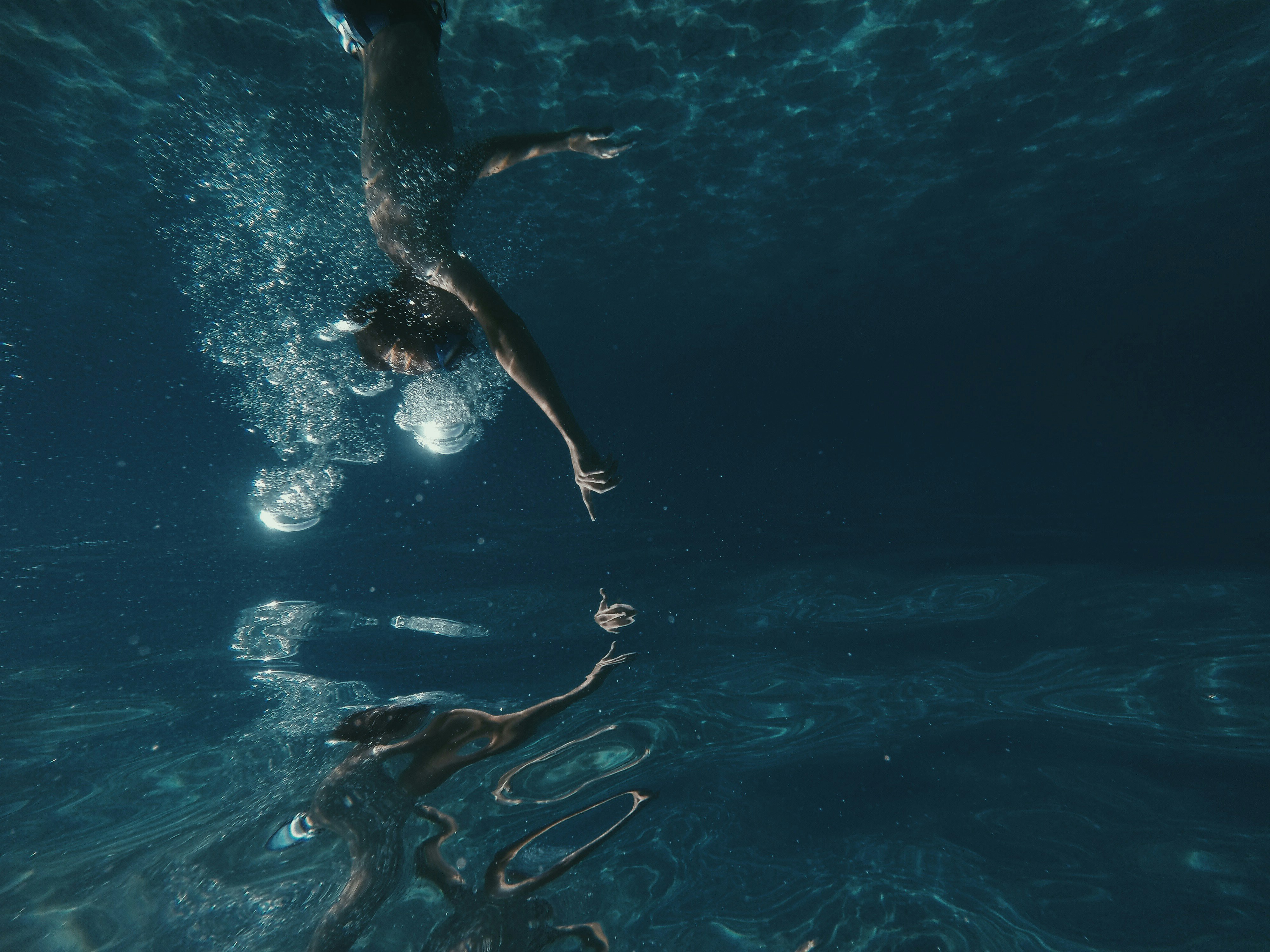 man swimming underwater