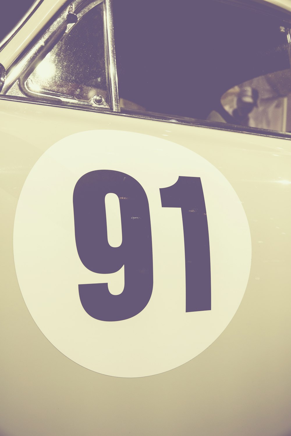 A car with a 91 decal on the driver's door.