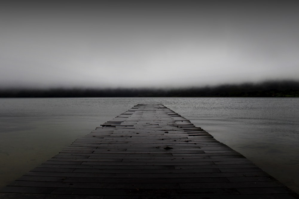 grayscale photography of dock