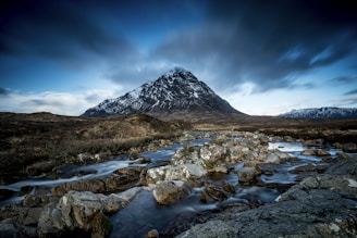 body of water at the foot of mountain