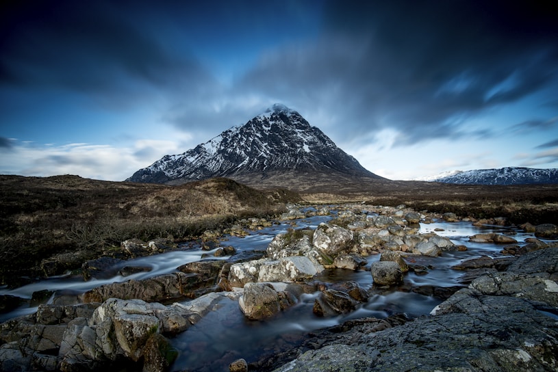 body of water at the foot of mountain