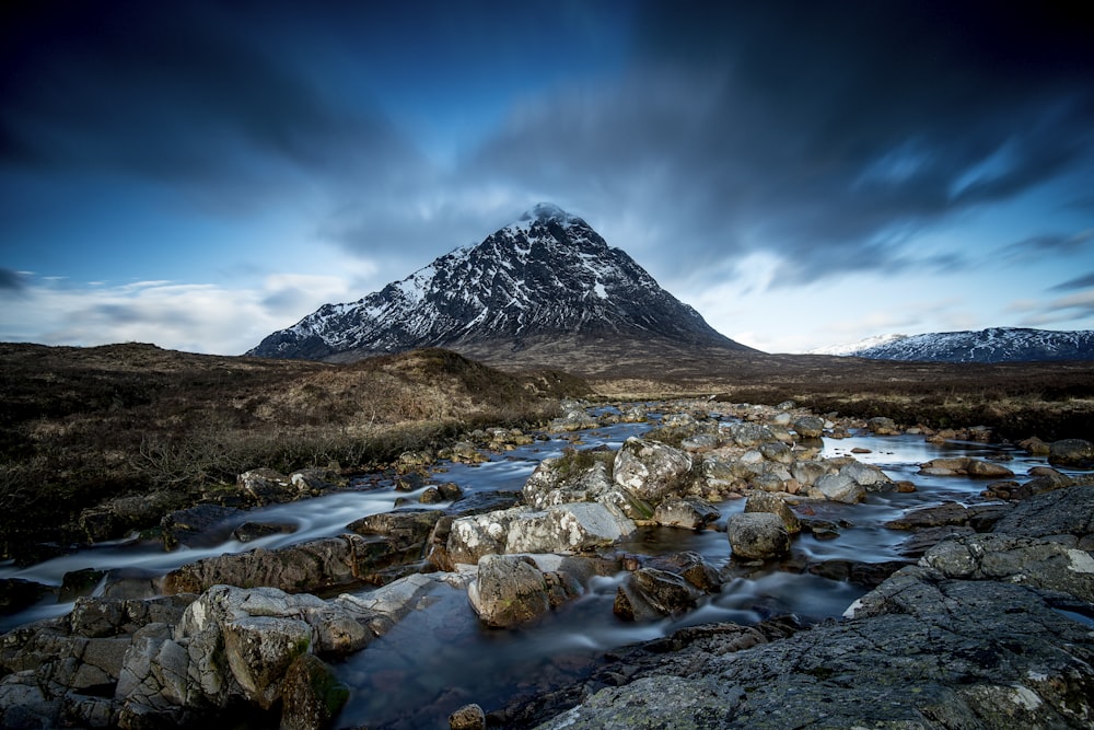 body of water at the foot of mountain