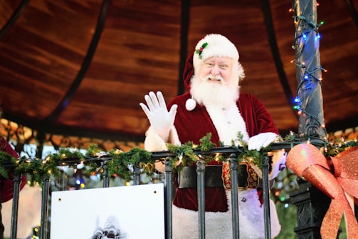 Santa Claus waving goodbye after a joyful visit.
