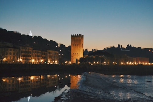 Tranquil evening view of Deva Towers illuminated softly against a twilight sky.