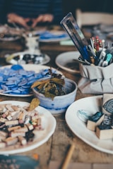 blue ceramic bowl on brown wooden table