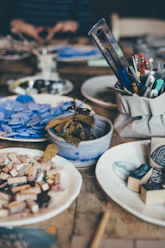 blue ceramic bowl on brown wooden table