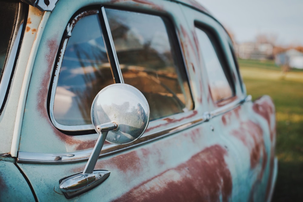 selective focus photography of classic gray and brown car