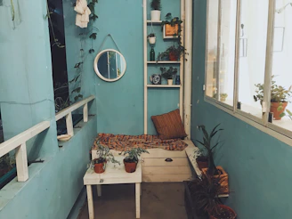 A stylish corner nook with plants and cozy seating, perfect for quiet moments.