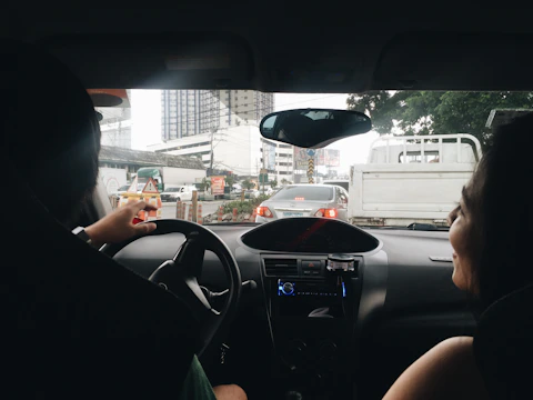 2D illustration of neighbors sharing a ride in a car.