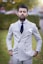 man in white and black pinstripe suit jacket