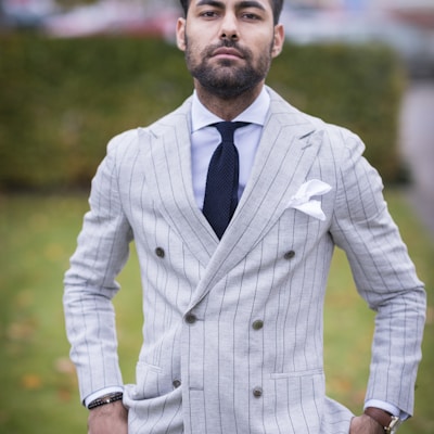 man in white and black pinstripe suit jacket