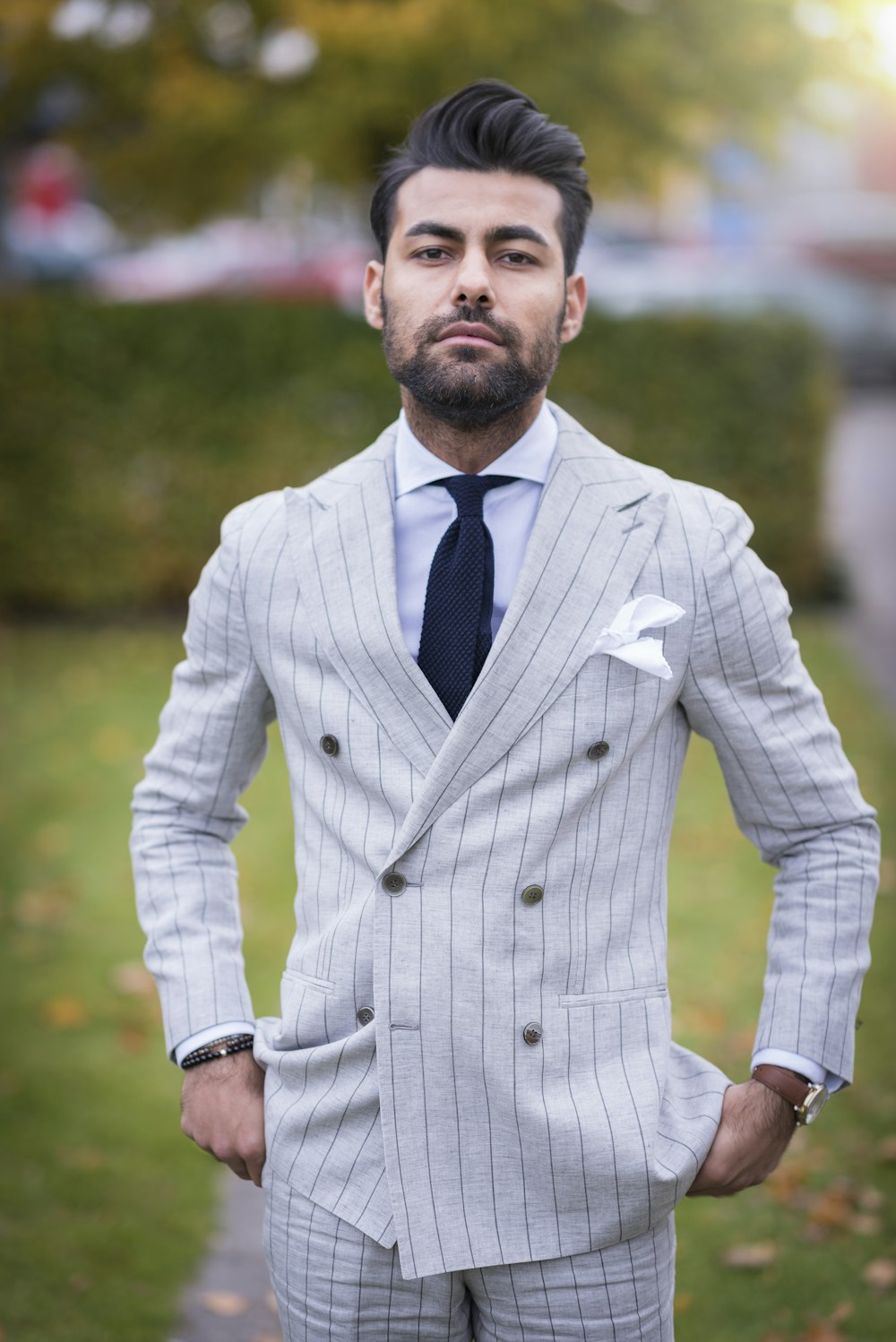 man in white and black pinstripe suit jacket