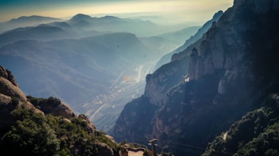 A stunning mountain landscape with a winding path leading into the distance.