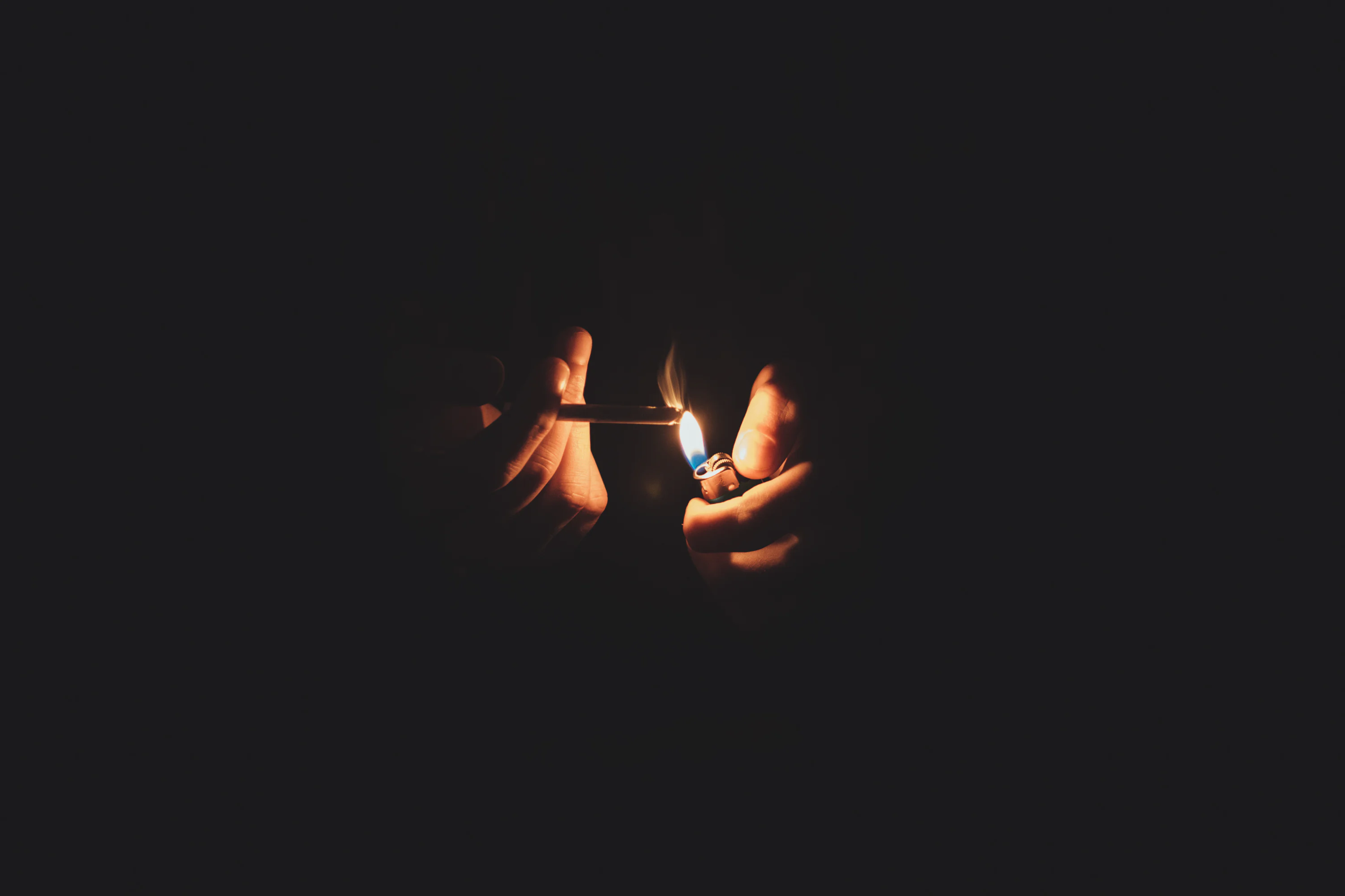 smoking cigarette in dark Free Smokey Glow Image - Smoke, Cigarette, Fingers Royalty-Free photo: Man holding lighter