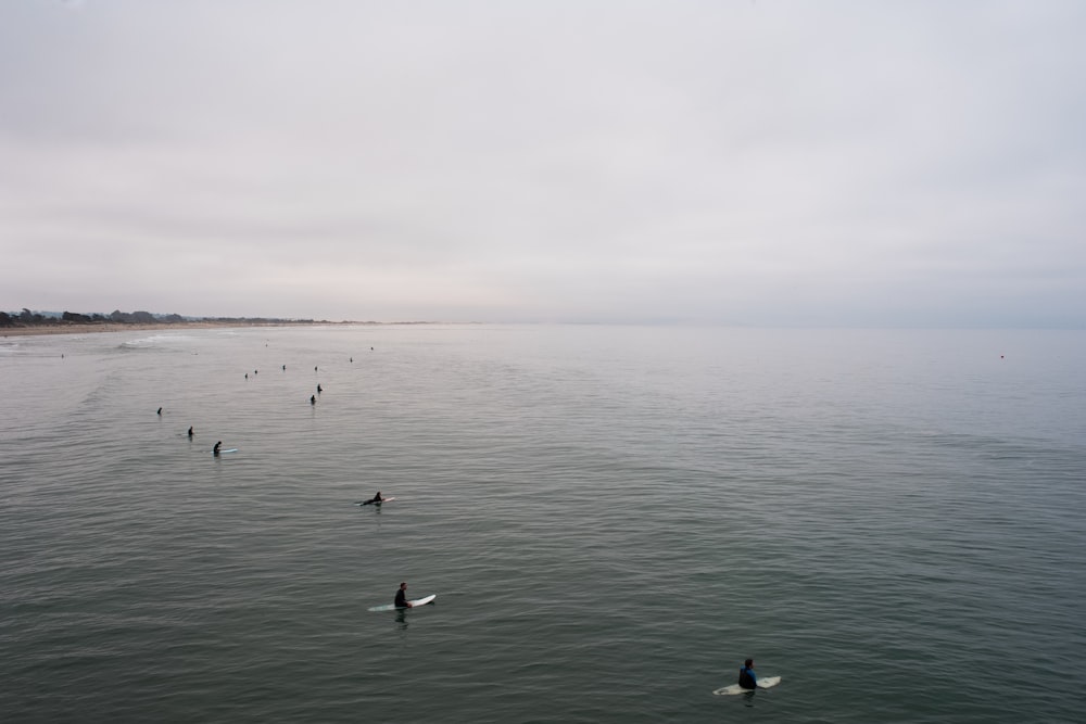 body of water under cloudy sky