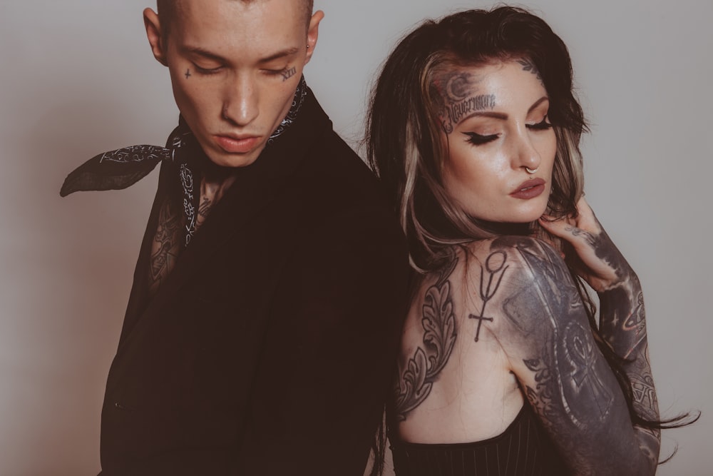 man and woman with tattoos