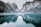 body of water and snow-covered mountains during daytime